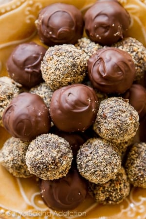 dark chocolate coconut rum balls on a gold plate