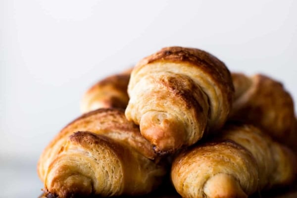 croissants on a wood serving tray